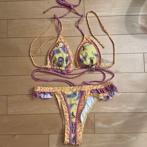 Bran new bikini, white red and blue print has a wraparound string for your waist